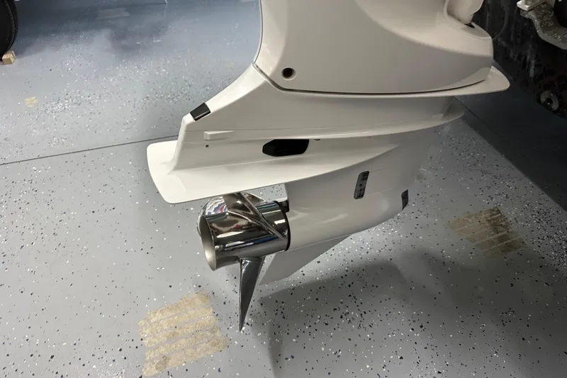 Slide: The Image of Close-up of 2023 Grady-White Fisherman 236 boat motor on speckled floor. - 26