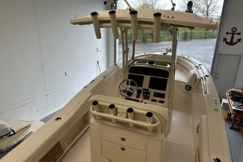 Slide: The Image of 2023 Grady-White Fisherman 236 boat interior with helm and rod holders. - 27
