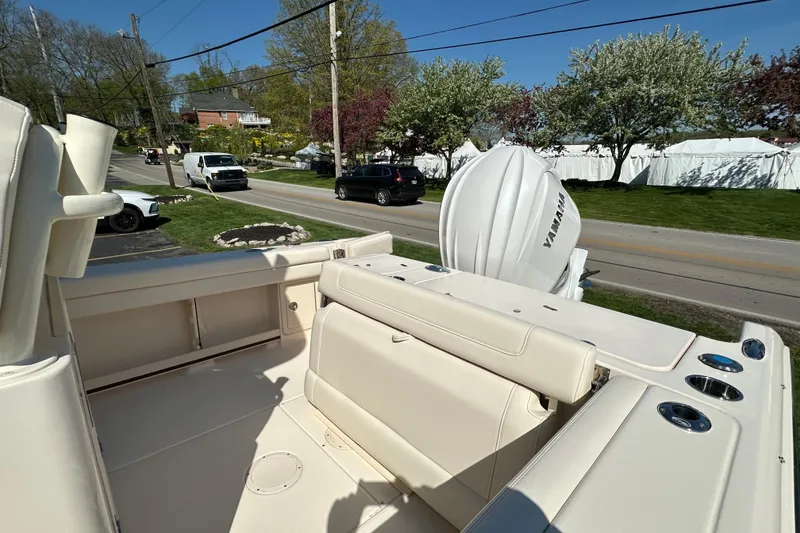 Slide: The Image of 2023 Grady-White Fisherman 236 boat with Yamaha engine, parked near a road. - 6