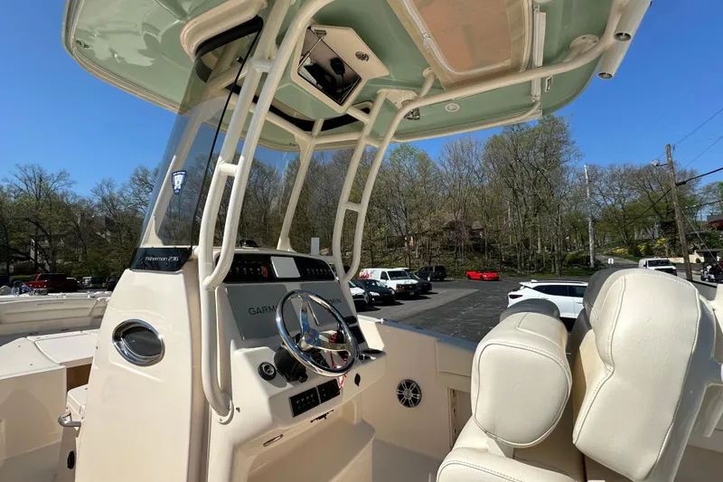 Slide: The Image of 2023 Grady-White Fisherman 236 boat interior with steering console and seating. - 7