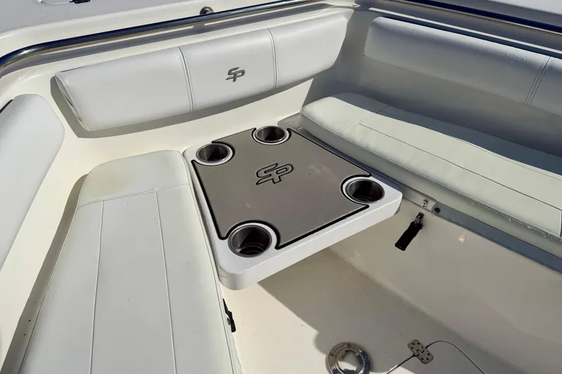 Slide: The Image of 2018 Sea Pro 219 Center Console boat seating area with cup holders. - 11