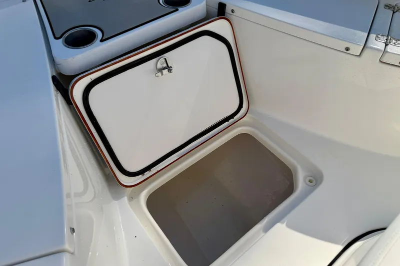 Slide: The Image of Open storage compartment on 2018 Sea Pro 219 Center Console boat. - 12