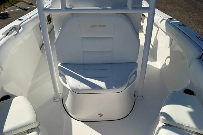 Slide: The Image of 2018 Sea Pro 219 Center Console boat interior with white seating and console. - 13