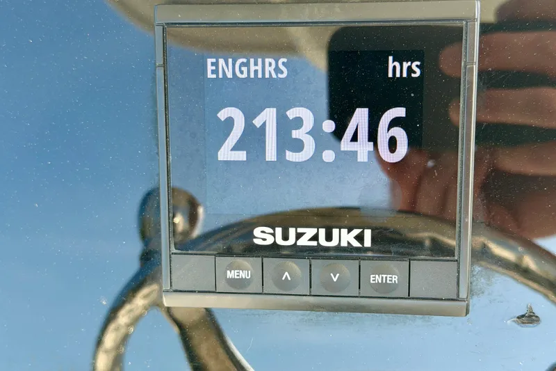 Slide: The Image of Suzuki engine hour meter displaying 213.46 hours on a 2018 Sea Pro 219 Center Console. - 16