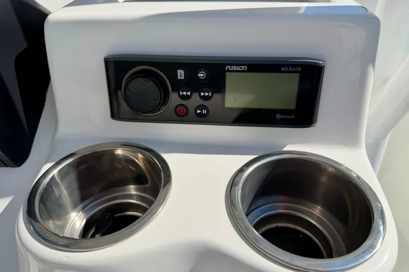 Slide: The Image of Fusion MS-RA70 stereo and cup holders on 2018 Sea Pro 219 Center Console boat. - 17