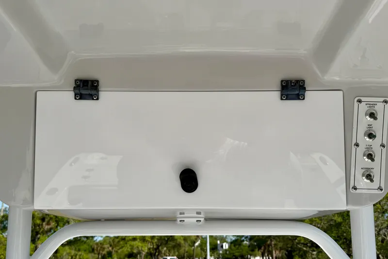 Slide: The Image of 2018 Sea Pro 219 Center Console boat dashboard with control panel and storage compartment. - 20