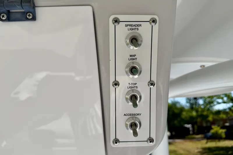 Slide: The Image of Switch panel on 2018 Sea Pro 219 Center Console boat with labeled light controls. - 21