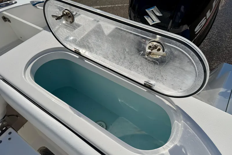 Slide: The Image of Open livewell on 2018 Sea Pro 219 Center Console boat with Suzuki engine. - 29