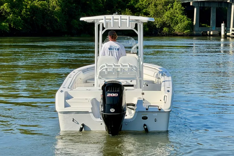 Slide: The Image of 2018 Sea Pro 219 Center Console boat on calm water, rear view. - 3