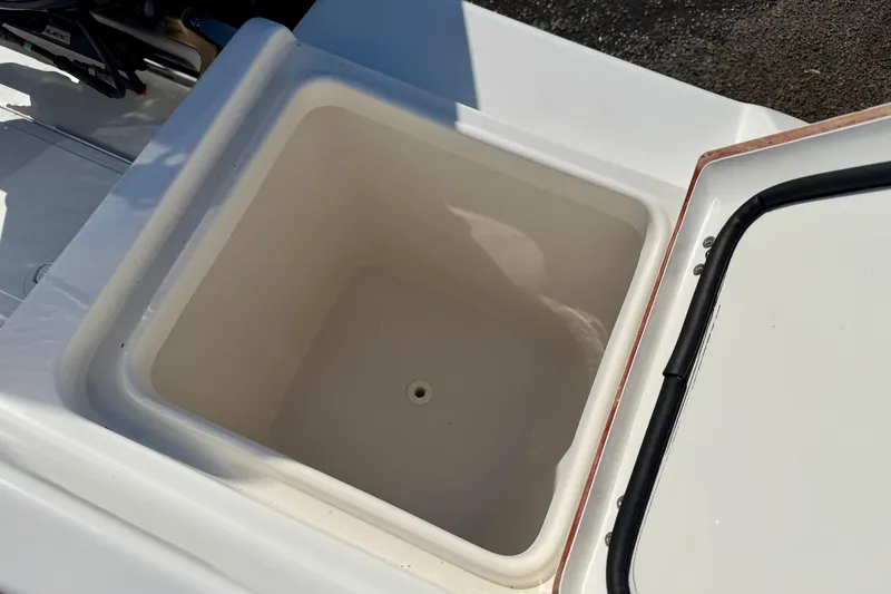 Slide: The Image of Open storage compartment on a 2018 Sea Pro 219 Center Console boat. - 30