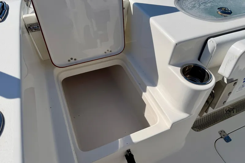 Slide: The Image of Open storage compartment on a 2018 Sea Pro 219 Center Console boat. - 31