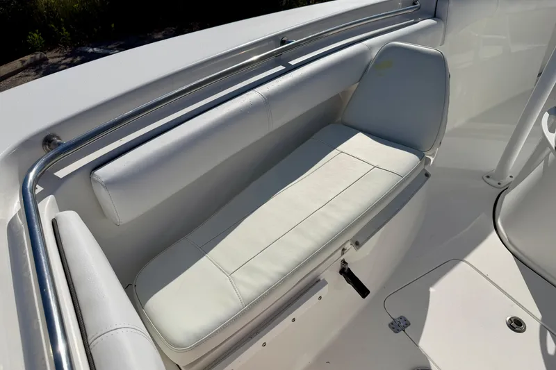 Slide: The Image of 2018 Sea Pro 219 Center Console boat interior seating with white cushions. - 6