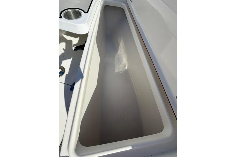 Slide: The Image of 2018 Sea Pro 219 Center Console storage compartment, open and empty. - 8