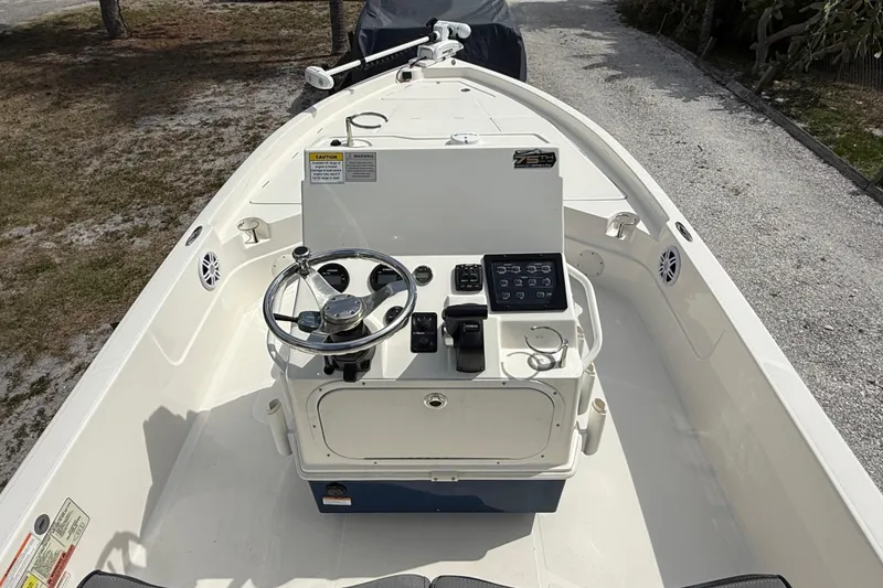 Slide: The Image of 2023 Skeeter SX230 boat console with steering wheel and control panel. - 20