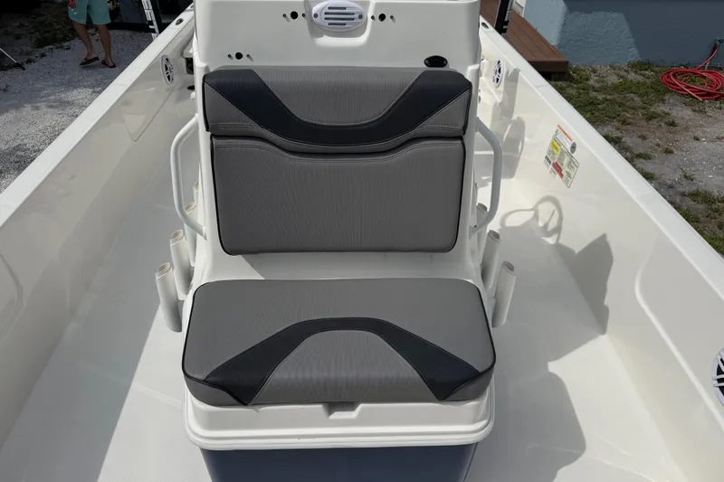 Slide: The Image of 2023 Skeeter SX230 boat seat with gray and black cushions. - 32