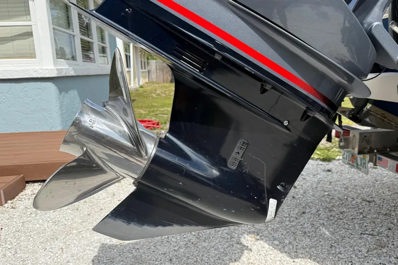 Slide: The Image of 2023 Skeeter SX230 boat propeller and motor detail in outdoor setting. - 9