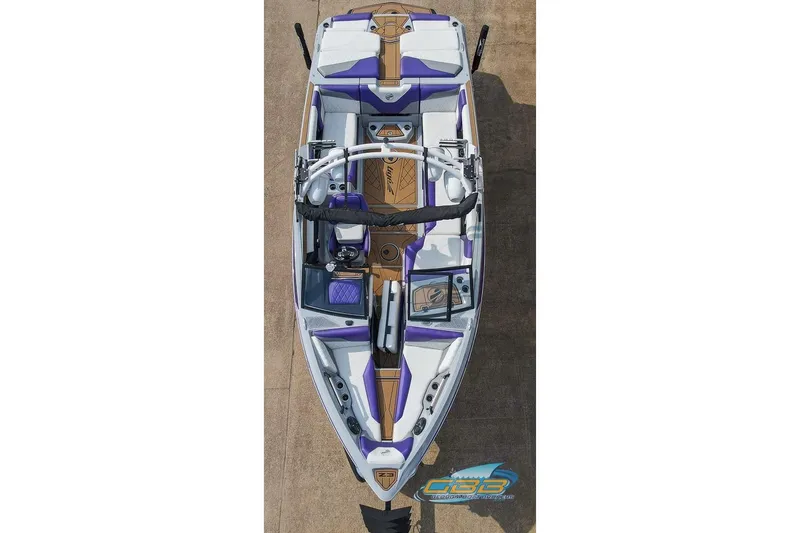 Slide: The Image of Overhead view of a 2022 Tigé Z3 boat with purple and white detailing. - 10
