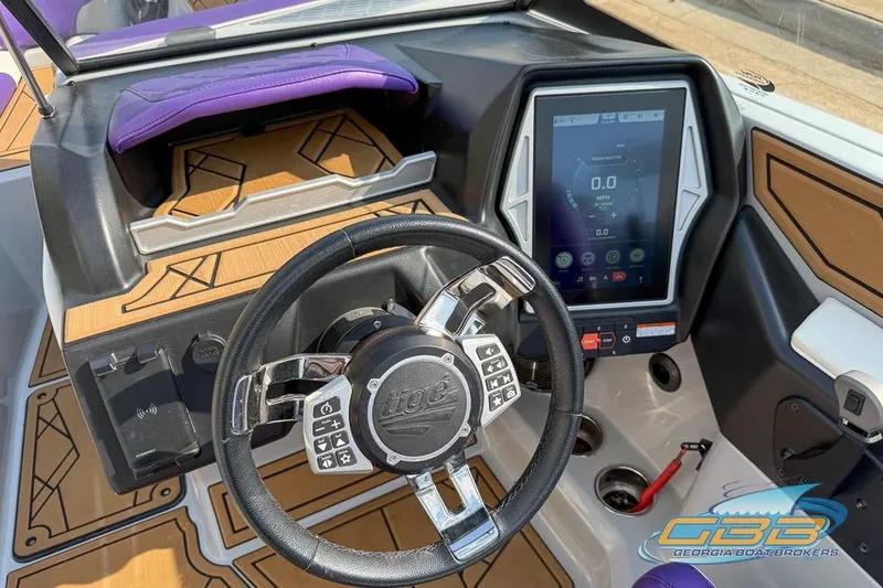Slide: The Image of 2022 Tigé Z3 boat dashboard with touchscreen display and steering wheel. - 11