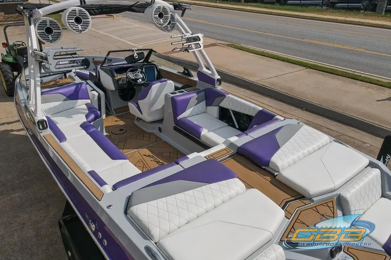 Slide: The Image of 2022 Tigé Z3 boat with purple and white interior, featuring advanced sound system and sleek design. - 15