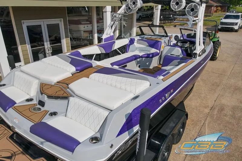 Slide: The Image of 2022 Tigé Z3 boat with purple and white interior, showcased at Georgia Boat Brokers. - 20
