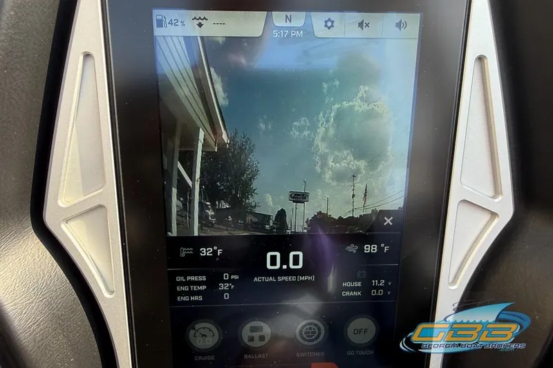 Slide: The Image of 2022 Tigé Z3 dashboard display showing speed, temperature, and camera view. - 25