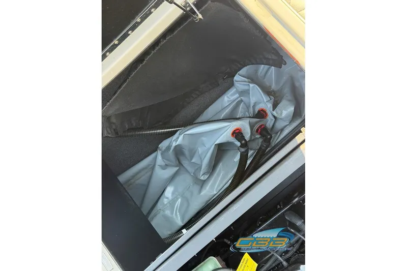 Slide: The Image of 2022 Tigé Z3 boat ballast system with hoses and connectors visible. - 27