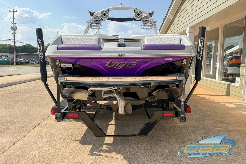 Slide: The Image of 2022 Tigé Z3 boat with purple accents, displayed at Georgia Boat Brokers. - 5