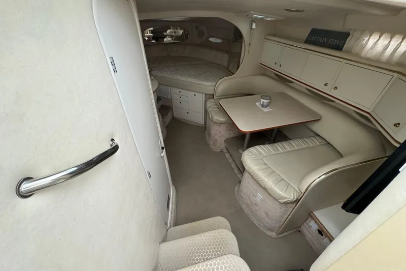 Slide: The Image of Interior of 2000 Sea Ray Sundancer 310 yacht with seating and table. - 11