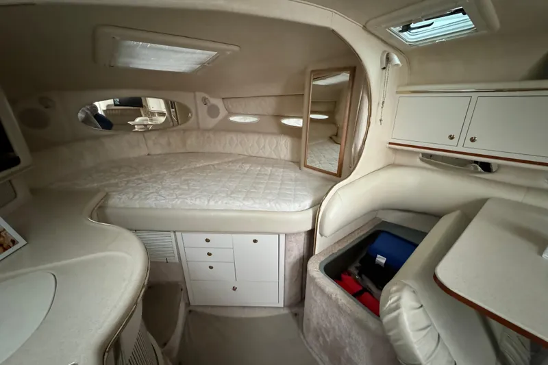 Slide: The Image of Interior of 2000 Sea Ray Sundancer 310 boat with cozy cabin and storage. - 16
