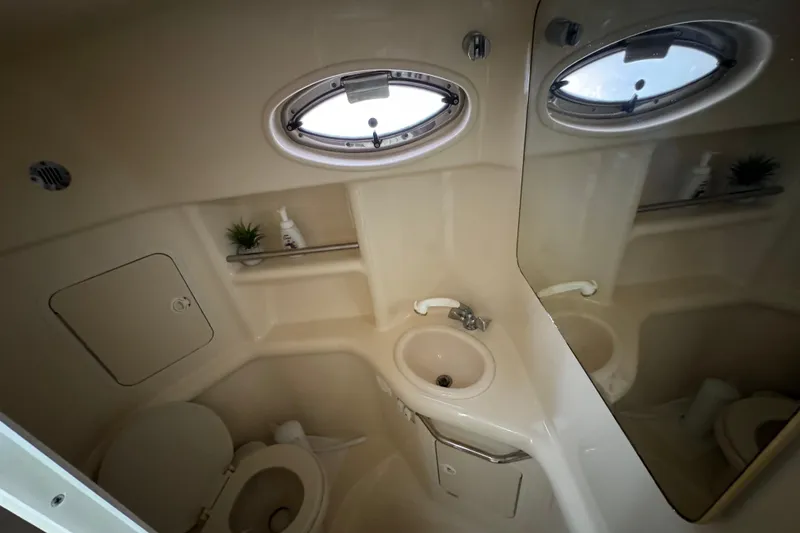 Slide: The Image of Bathroom interior of 2000 Sea Ray Sundancer 310 yacht with sink and porthole window. - 20