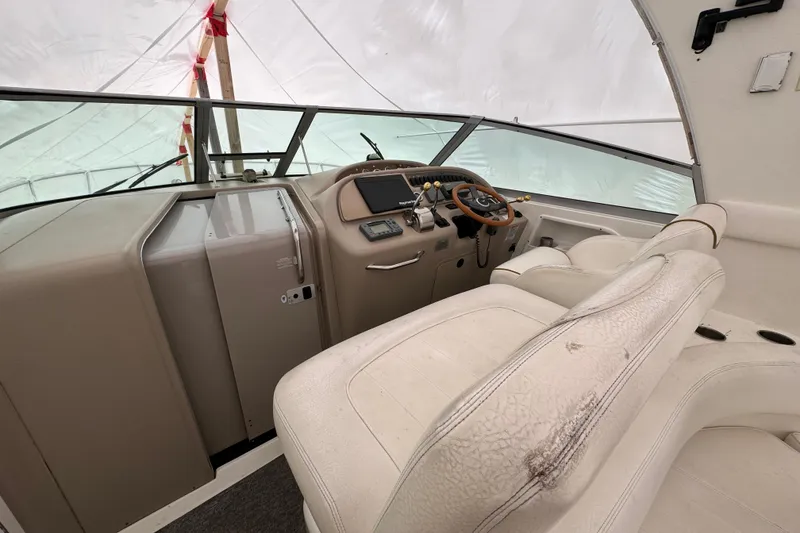 Slide: The Image of Interior cockpit of 2000 Sea Ray Sundancer 310 boat with steering wheel and seating. - 3