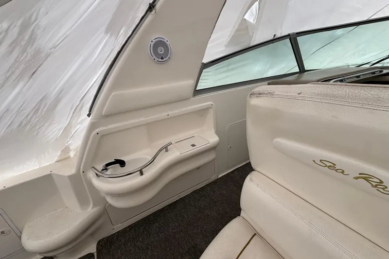 Slide: The Image of Interior of a 2000 Sea Ray Sundancer 310 boat with seating and storage. - 4