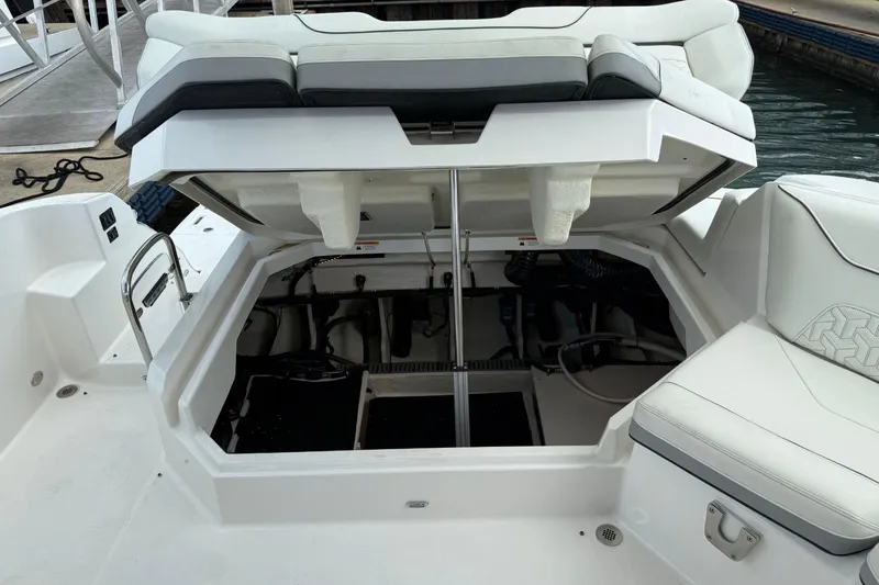 Slide: The Image of 2023 Regal LX36 boat with open engine compartment, showcasing interior mechanics. - 17