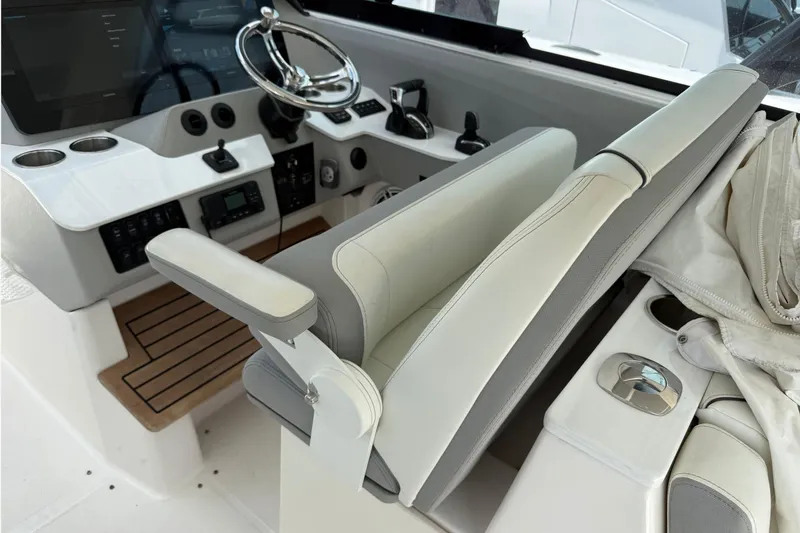 Slide: The Image of 2023 Regal LX36 boat helm with modern controls and luxurious seating. - 19