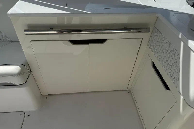 Slide: The Image of 2023 Regal LX36 boat interior with sleek cabinetry and modern design elements. - 22