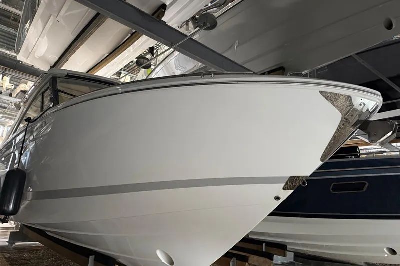 Slide: The Image of 2023 Regal LX36 boat in storage, showcasing sleek design and modern features. - 28