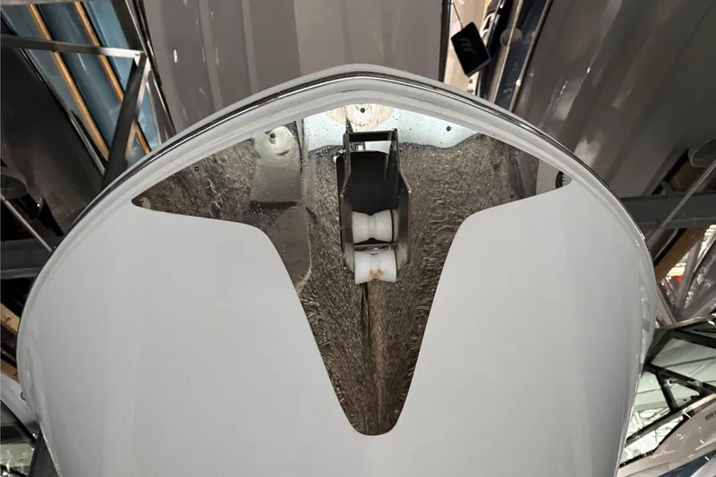 Slide: The Image of 2023 Regal LX36 boat hull close-up in storage facility. - 33