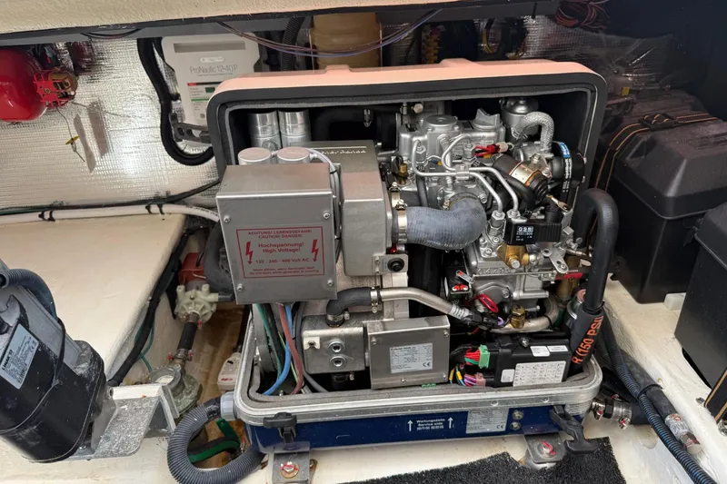 Slide: The Image of Engine compartment of a 2023 Regal LX36 boat, showcasing detailed mechanical components. - 37