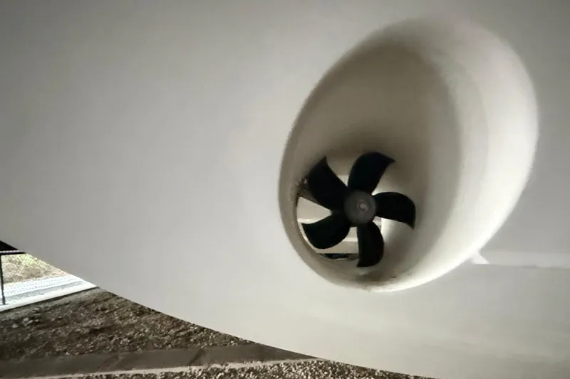 Slide: The Image of Close-up of 2023 Regal LX36 boat's bow thruster under the hull. - 38