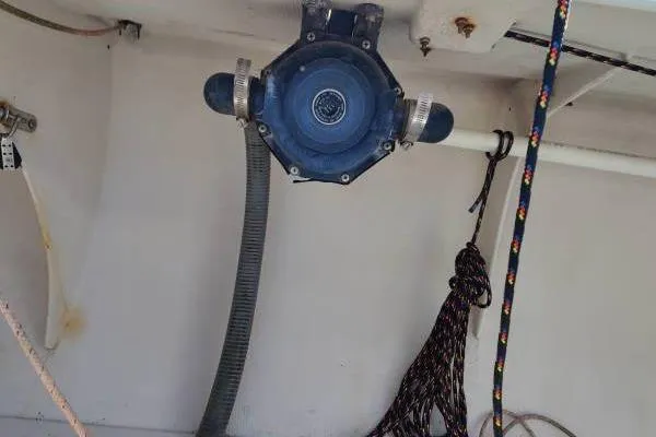 Slide: The Image of 1982 Ontario Yachts Etchells boat interior with pump and ropes visible. - 15