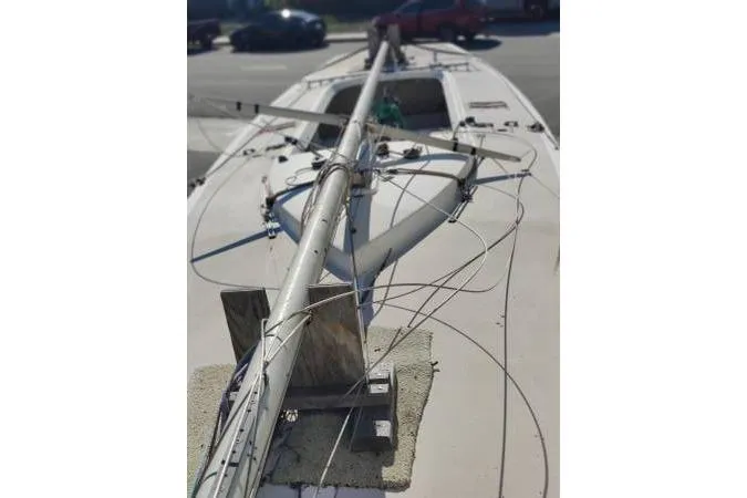 Slide: The Image of 1982 Ontario Yachts Etchells sailboat with mast and rigging on deck. - 16