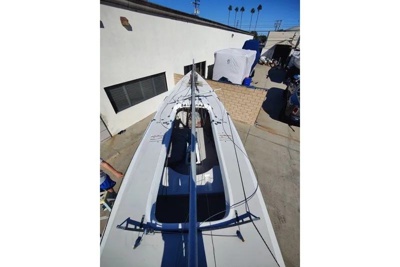 Slide: The Image of 1982 Ontario Etchells sailboat in a sunny outdoor storage area. - 4