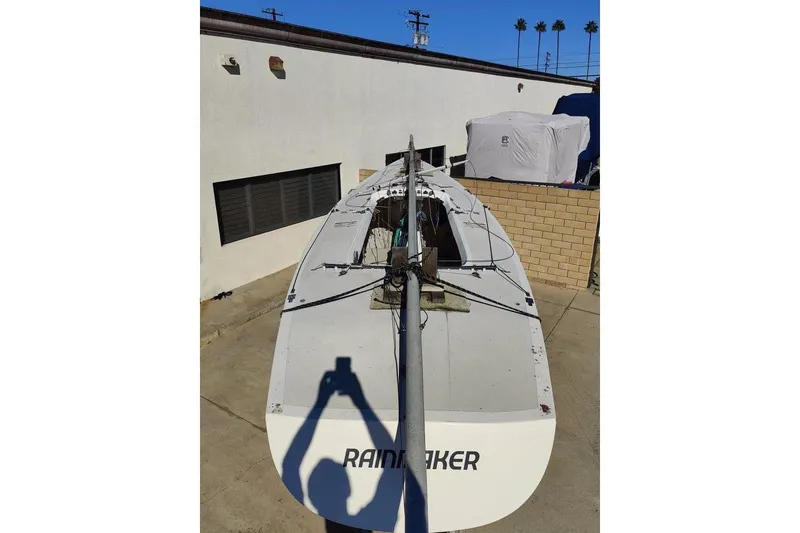 Slide: The Image of 1982 Ontario Etchells sailboat in a driveway, shadow of a person taking photo. - 6