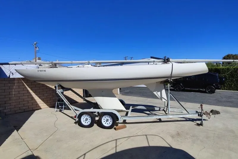 Slide: The Image of 1982 Ontario Etchells sailboat on trailer under clear blue sky. - 8