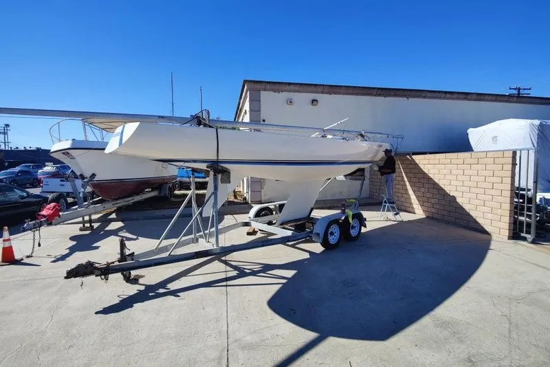 Slide: The Image of 1982 Ontario Etchells sailboat on trailer in sunny outdoor storage area. - 9