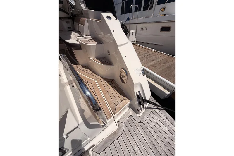 Slide: The Image of 2018 Sea Ray Sundancer 350 Coupe yacht with teak deck at marina. - 12