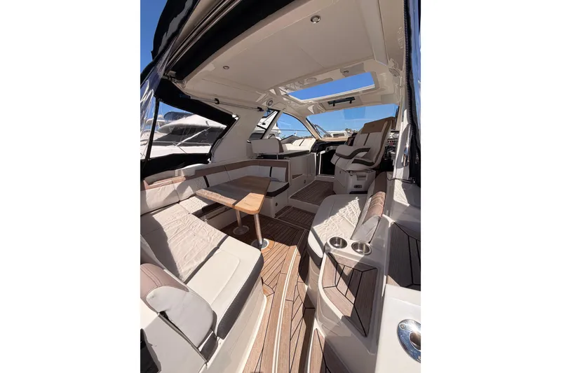 Slide: The Image of Luxurious interior of 2018 Sea Ray Sundancer 350 Coupe with elegant seating and wooden accents. - 17