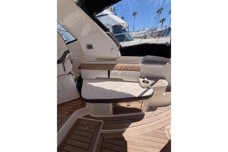 Slide: The Image of Interior of 2018 Sea Ray Sundancer 350 Coupe with elegant seating and wood flooring. - 25