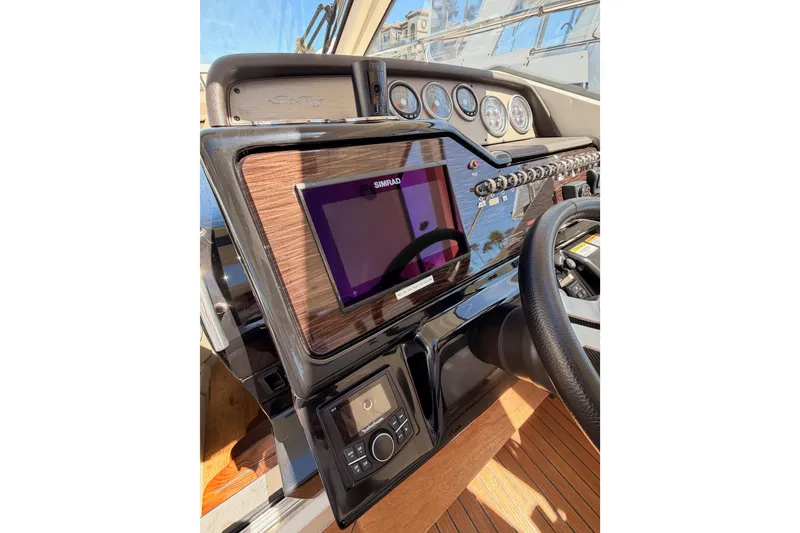 Slide: The Image of 2018 Sea Ray Sundancer 350 Coupe helm with Simrad display and gauges. - 33