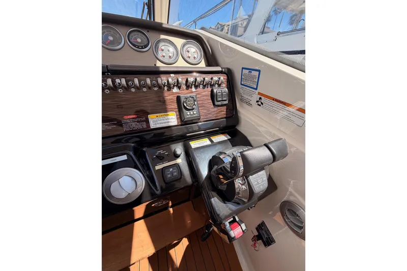 Slide: The Image of Control panel of 2018 Sea Ray Sundancer 350 Coupe with gauges and throttle. - 34